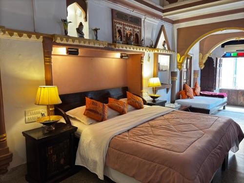 a bedroom with a large bed in a room at Shahi Guest House in Jodhpur
