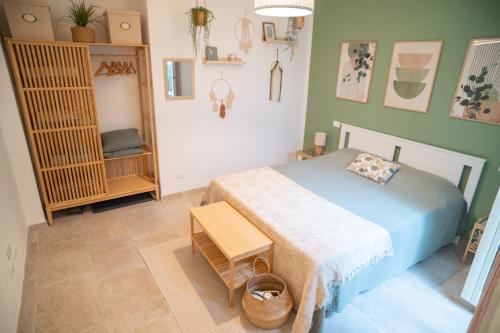 a bedroom with a bed in a room with green walls at Casa Mura in Bracciano