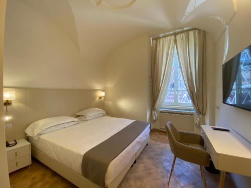 Basilica Hotelにあるベッド