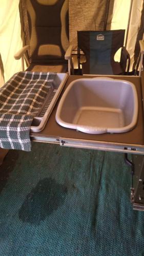 a sink sitting on top of a table at Isikhoma-Khoma in Hilton