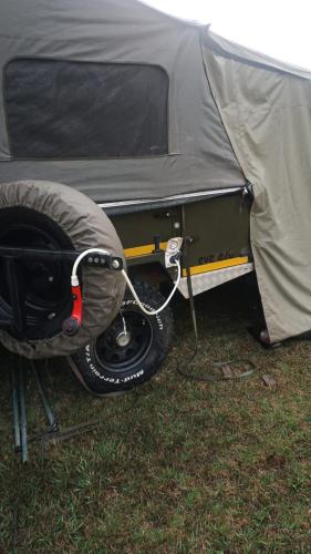 a tent with a tire in the front of it at Isikhoma-Khoma in Hilton