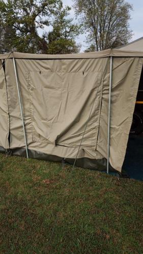 a tent sitting in the grass in a field at Isikhoma-Khoma in Hilton
