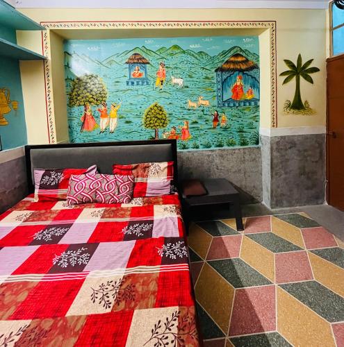 a bedroom with a bed with a painting on the wall at MOON NIGHT GUEST HOUSE in Jodhpur