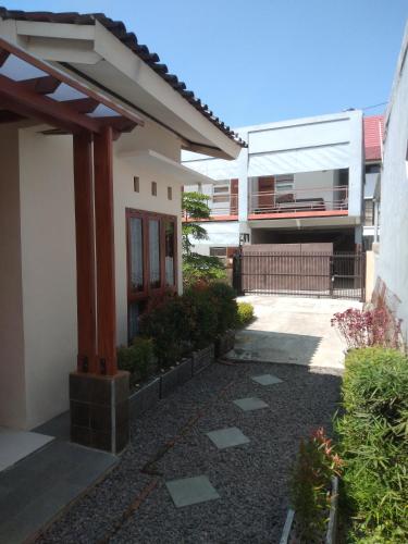 a building with a pathway in front of a building at Villa Viva Mezzanine - Family in Lembang