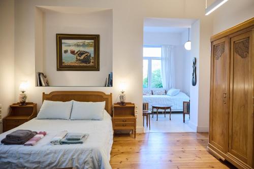 a bedroom with a bed with two towels on it at 1906 Citygarden in Chios