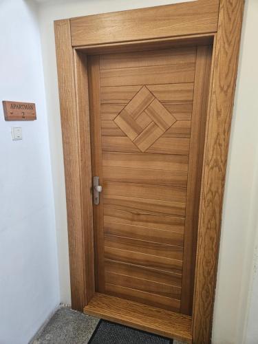 a wooden door in a hallway at Apartmán Eliašova 2 in Česká Lípa