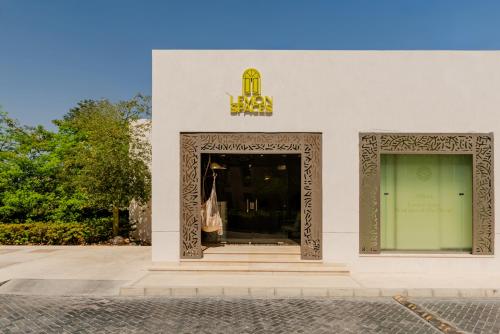 a store front with a window and a sign on it at Boutique Residence Mangroovy-Lemon Spaces Gouna in Hurghada