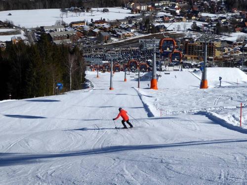a person skiing down a snow covered ski slope at Haus Peter in Murau