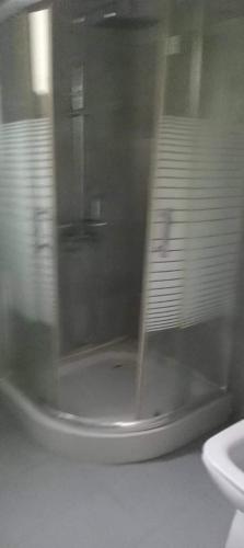 a view of a bathroom through a glass window at Rohan's Residence in Kandana