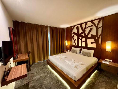 Postel nebo postele na pokoji v ubytování De Cozé Hotel