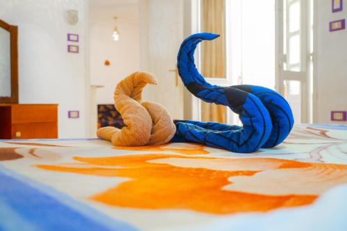 two stuffed animals are laying on a table at Akhenaten Apartments in Luxor