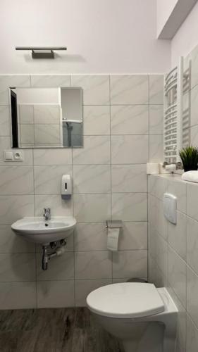Ένα μπάνιο στο Apartamenty Marciniak