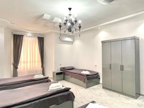 Guesthouse Asteriya Гостевой домにあるベッド