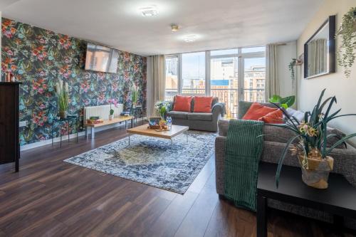 a living room with a couch and a table at Movie House Executive Suite - Secure Free Parking in Belfast
