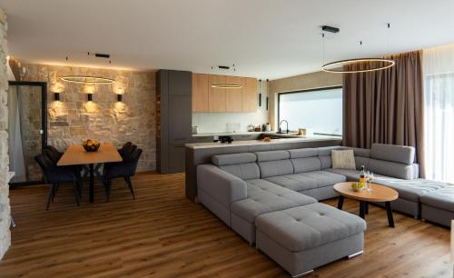 a living room with a couch and a table at Villa Studenec in Banská Štiavnica