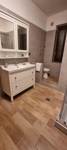 a bathroom with a sink and a toilet at Santa Maria Apartments in Forino