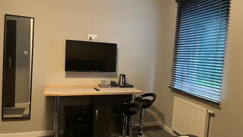 Μια τηλεόραση ή/και κέντρο ψυχαγωγίας στο Apartamenty Marciniak