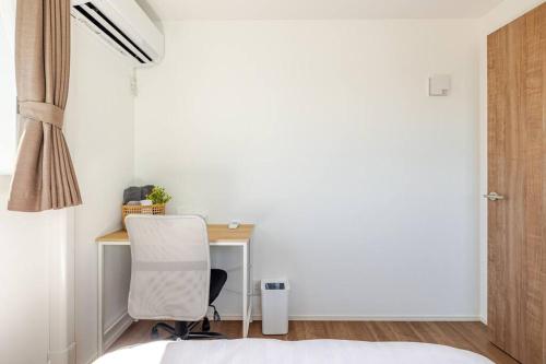 Postel nebo postele na pokoji v ubytování 站前1分钟 近镰仓 江之岛等景点 全新一户建 直达东京新宿 江之岛 可住7人 带天台