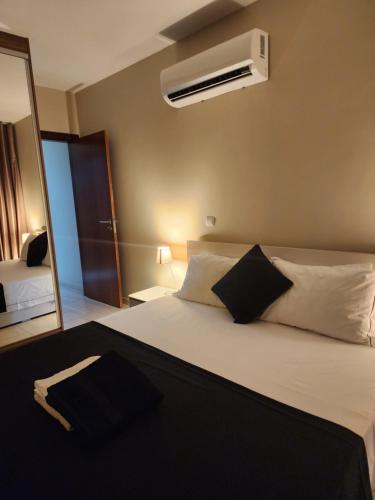 Postel nebo postele na pokoji v ubytování Apartamento com Vista para a Baía de Luanda