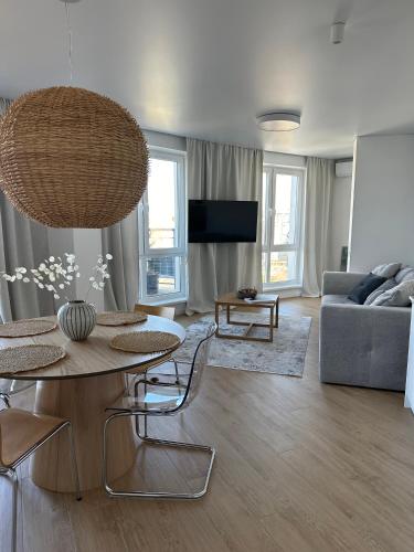 a living room with a table and a couch at Апартаменти Мон Блан in Khmelʼnytsʼkyy