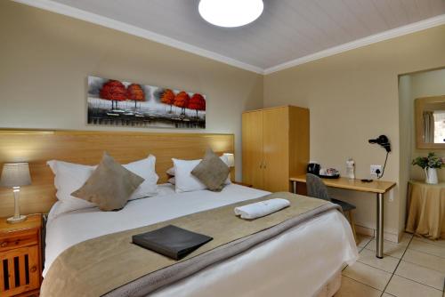 Voodi või voodid majutusasutuse Sunrock Guesthouse toas