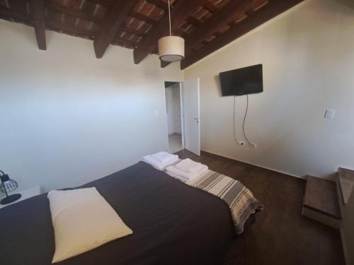 Ένα ή περισσότερα κρεβάτια σε δωμάτιο στο La Casa de Bimba