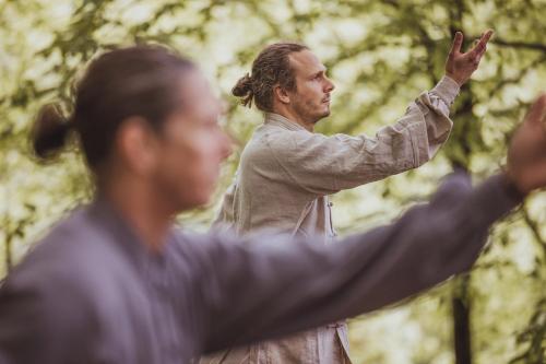 a man standing with his arm outstretched at STF Villa Söderåsen B&B in Röstånga