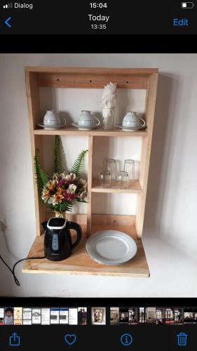 a picture of a shelf with a plate in it at King's Lodge in Nuwara Eliya