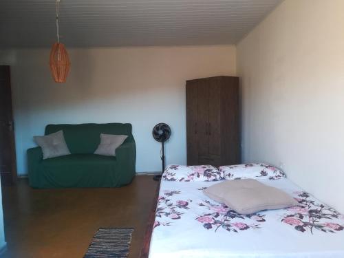 En eller flere senge i et værelse på Chalet Vida de Roça