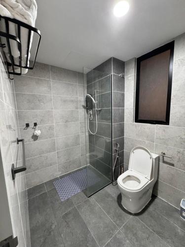 a bathroom with a shower and a toilet at Homestay Abg Ipar in Putrajaya