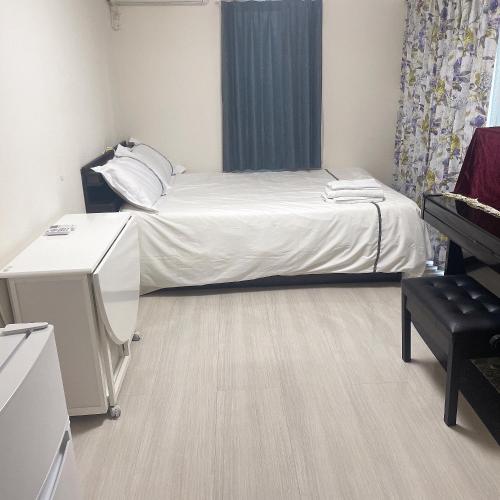 Postel nebo postele na pokoji v ubytování 東京小岩与房东同住mishe