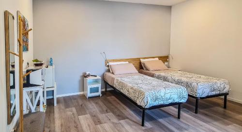 Postel nebo postele na pokoji v ubytování Adriroomsrho