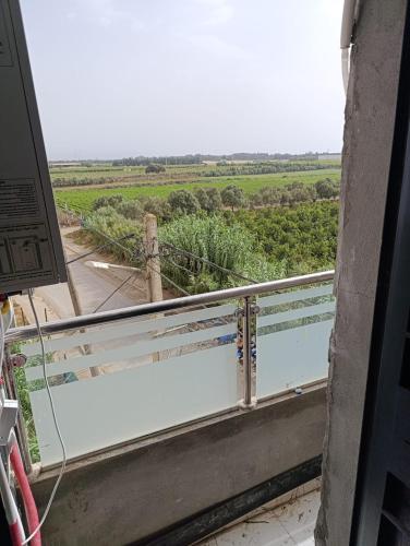 a balcony with a view of a field at Appartement Grand Lux, Jaccuzi, Proche Aeroport in Reghaïa
