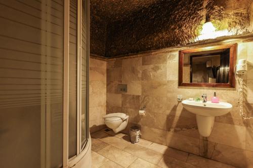 a bathroom with a sink and a toilet at Century Cave Hotel in Goreme