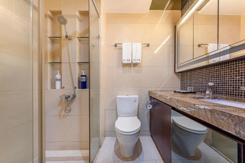 Ένα μπάνιο στο 广州家馨商务住宿（科汇金谷神州路地铁站店）