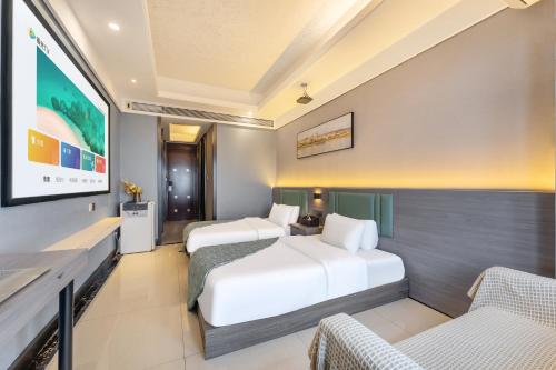 Ένα ή περισσότερα κρεβάτια σε δωμάτιο στο STAR STAGE International Apartment Hotel - 1min to Line2 & Line8 ChangGang STN-Free private car delivery to Canton Fair from Otc 15th to Nov 4th