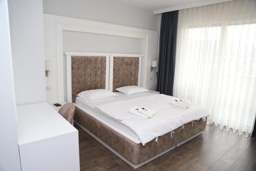 Postel nebo postele na pokoji v ubytování Sky Hotel