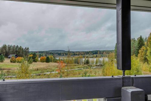 a view of a field from a window at Lomahuoneisto Karkelopirtti 2 B in Himos