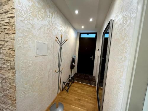 a hallway with a room with a phone on the wall at Am Gifizsee 3 Zim Apartment für Familien in Offenburg