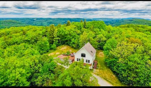 an aerial view of a house in the middle of a forest at SRC-Hudson Valley, Berkshires Cultural Corridor in Canaan