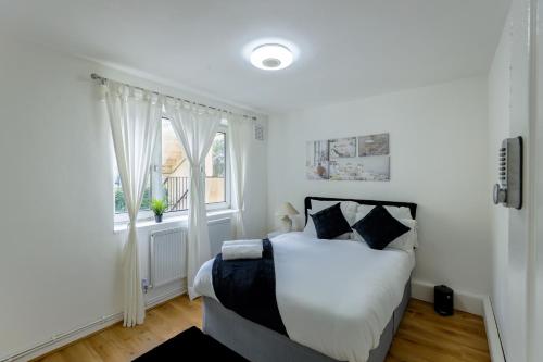 Ένα ή περισσότερα κρεβάτια σε δωμάτιο στο Opulent Heights
