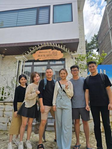 a group of people standing in front of a building at An's House SaPa - Nguyên Căn 5 Phòng Ngủ View Núi in Sa Pa