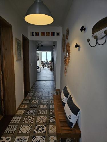 a hallway with a staircase with pillows on the wall at Esplanada do Ilhéu in Vila Franca do Campo