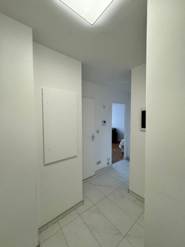 a hallway with white walls and a ceiling at STUDIO Zone touristique in Brussels