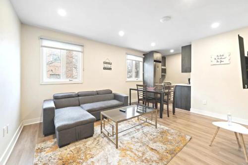 a living room with a couch and a table at Fancy 3 BDR in Heart of Plateau B in Montréal
