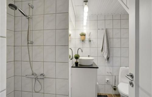 a white bathroom with a shower and a sink at Stunning Home In Vestervig With Wifi in Vestervig