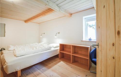 a bedroom with a bed and a desk and a window at Lovely Home In Silkeborg in Silkeborg