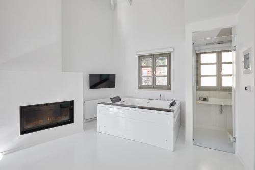 Televízia a/alebo spoločenská miestnosť v ubytovaní Clock Tower Aparthotel