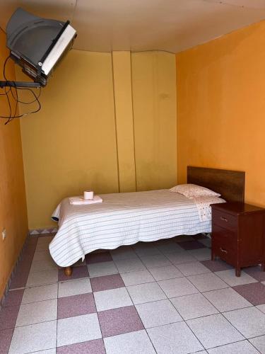 Postel nebo postele na pokoji v ubytování Hospedaje El Centro