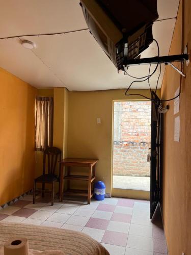 Postel nebo postele na pokoji v ubytování Hospedaje El Centro